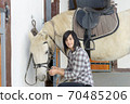 Beautiful young girl and white horse 70485206