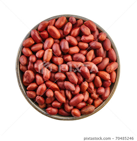 raw peanuts in bowl close-up with clipping path 70485246