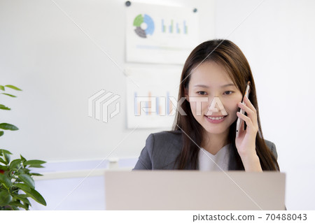 Woman calling for business Woman calling for business 70488043