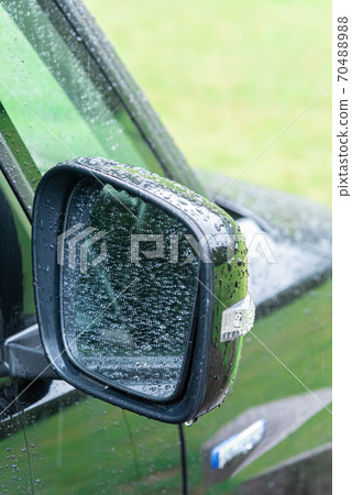 Side mirror of a car wet in the rain 70488988