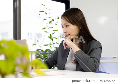 A woman working A woman working 70489072