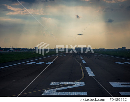 Airplane taking off from the runway Airplane taking off from the runway 70489312