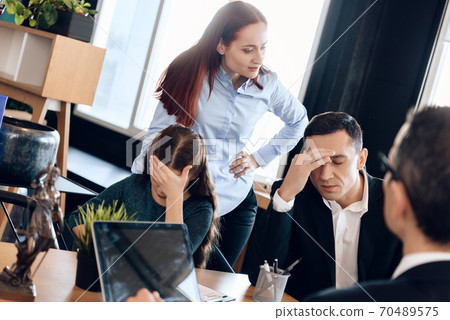 Man hold hand to head in pain at the lawyers office. Man hold hand to head in pain at the lawyers office. 70489575