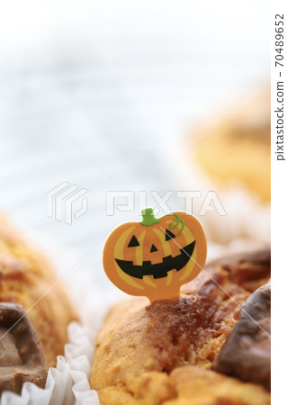 Homemade pumpkin muffins with Halloween picks Homemade pumpkin muffins with Halloween picks 70489652