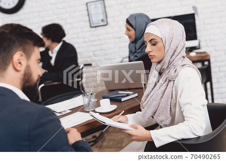 Disabled arab man in suit in wheelchair.  70490265