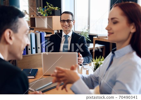 Attorney in business suit is sitting in office. Attorney in business suit is sitting in office. 70490341