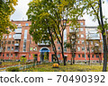 In the courtyard of stalinka building. Orange and green trees, Ukraine, Kharkov 70490392