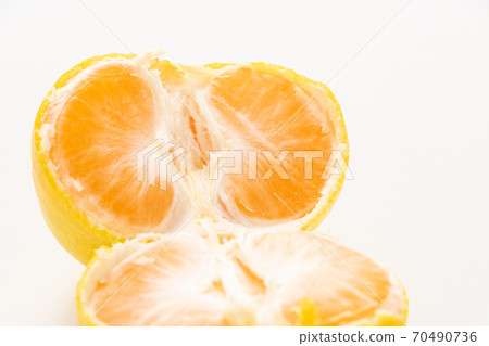 Mandarin oranges split in half by hand. (White background) 70490736