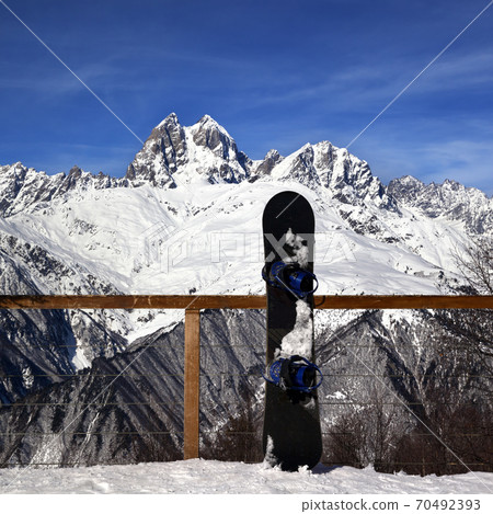Snowboards in outdoor cafe at ski resort at sun winter day 70492393