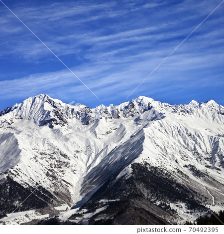 Snowy mountains at sun winter day Snowy mountains at sun winter day 70492395