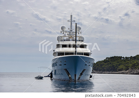 Blue luxury motor yacht, anchored in the calm sea 70492843