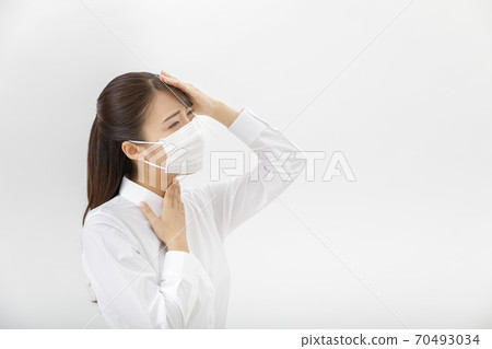 A woman wearing a mask 70493034
