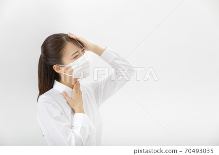 A woman wearing a mask 70493035