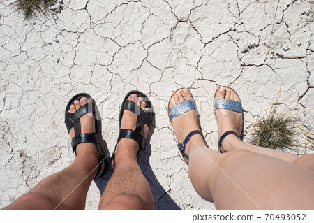 Premium Photo | Female feet in sandals on a street pavement person