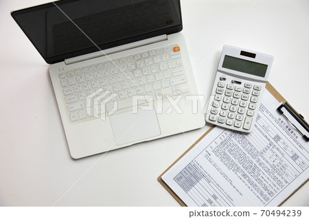 Real estate contract and laptop Real estate contract and laptop 70494239