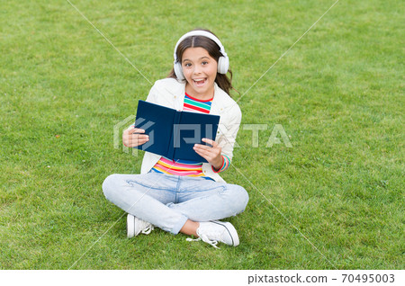 Work hard. small girl reading book. literature for kids.  70495003