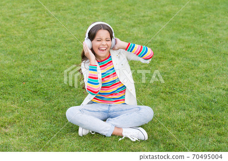 Pleasant time. Child headphones listen music. Do not bother me. Cool girl headphones listening Pleasant time. Child headphones listen music. Do not bother me. Cool girl headphones listening 70495004