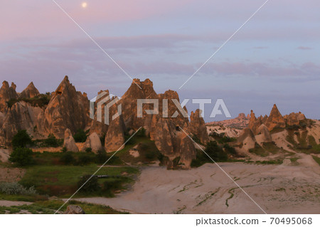 Many buses near Cappadocia rocks. 70495068