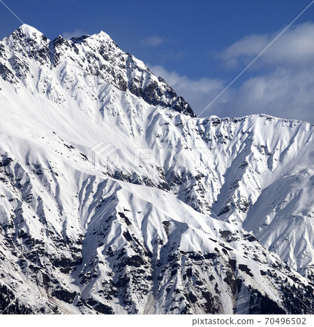 Snowy sunlight mountains at nice day Snowy sunlight mountains at nice day 70496502