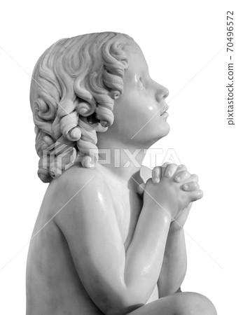 Boy statue pray to God with hands held together. Beautiful old stone statue of praying child isolated on white background Boy statue pray to God with hands held together. Beautiful old stone statue of praying child isolated on white background 70496572