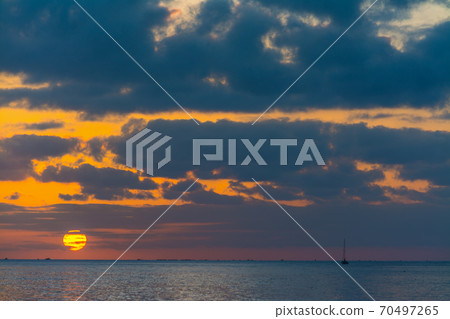 Dramatic sky at sunset over the sea 70497265