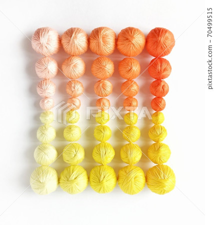 Yellow and orange balls of yarn. Yellow and orange balls of yarn. 70499515