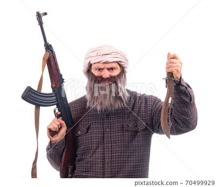 The bearded man armed with kalashnikov and knife isolated on a white background. The bearded man armed with kalashnikov and knife isolated on a white background. 70499929