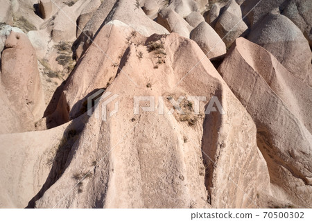 Unique geological formations in red valley, Cappadocia, Turkey. 70500302