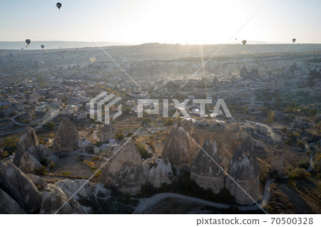 Cappadocia landscape with flying hot air balloons. Cappadocia landscape with flying hot air balloons. 70500328