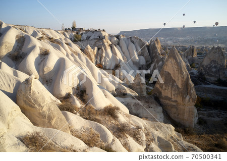Valley with volcanic tuff stone rocks in Goreme, Turkey. Valley with volcanic tuff stone rocks in Goreme, Turkey. 70500341