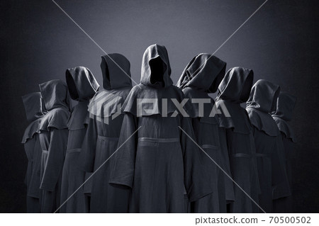 Group of nine scary figures in hooded cloaks in the dark Group of nine scary figures in hooded cloaks in the dark 70500502
