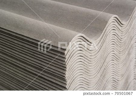 wave asbestos-cement slates stacked for use in home construction. wave asbestos-cement slates stacked for use in home construction. 70501067