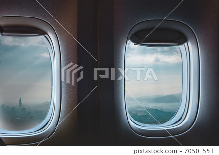 Airplane interior with window view of Taipei city, Taiwan. Concept of travel and air transportation Airplane interior with window view of Taipei city, Taiwan. Concept of travel and air transportation 70501551