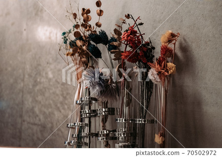 Concrete and dried flowers Concrete and dried flowers 70502972