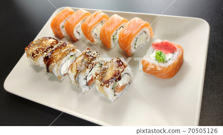 California and philadelphia roll with red chopsticks on a plate 70505126