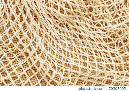 Texture of mesh string reusable knitted bag. Concept of zero waste, recycling, ecology. 70507005
