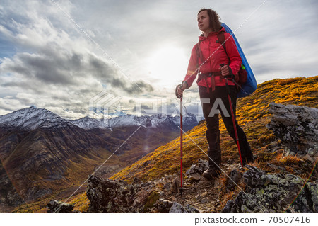 Woman Backpacking in Scenic Mountain Landscape 70507416