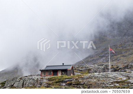 Norwegian wooden mountain huts cabin, flag, Norway 70507659