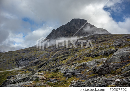 Mountain peak with clouds view on Trolls Path 70507702