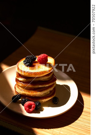 Pancakes with berries 70507922