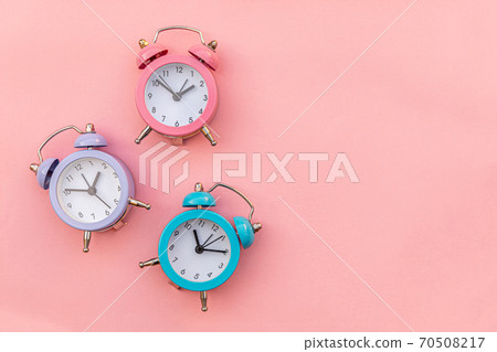 Simply minimal design three ringing twin bell classic alarm clock Isolated on pink pastel background. Rest hours time of life good morning night wake up awake concept. Flat lay top view copy space. Simply minimal design three ringing twin bell classic alarm clock Isolated on pink pastel background. Rest hours time of life good morning night wake up awake concept. Flat lay top view copy space. 70508217