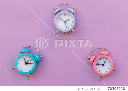 Simply minimal design three ringing twin bell classic alarm clock Isolated on purple violet background. Rest hours time of life good morning night wake up awake concept. Flat lay top view copy space. Simply minimal design three ringing twin bell classic alarm clock Isolated on purple violet background. Rest hours time of life good morning night wake up awake concept. Flat lay top view copy space. 70508218