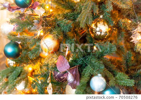 Classic Christmas New Year decorated New year tree with golden ornament decorations toy and ball. Modern white classical style interior design apartment. Christmas eve at home. Classic Christmas New Year decorated New year tree with golden ornament decorations toy and ball. Modern white classical style interior design apartment. Christmas eve at home. 70508276