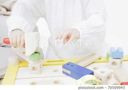 Infants playing with toys Infants playing with toys 70509943