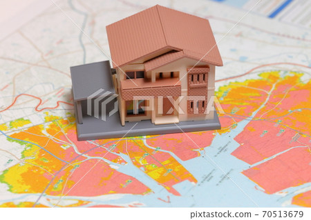 Tsunami hazard map and miniature house Tsunami hazard map and miniature house 70513679