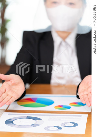 Business face shield woman (focus at hand) Business face shield woman (focus at hand) 70513965