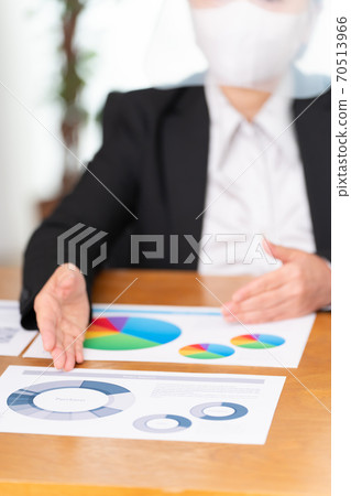 Business face shield woman (focus at hand) Business face shield woman (focus at hand) 70513966