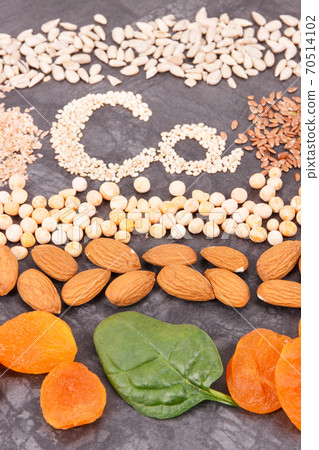 Different ingredients as source calcium, minerals and fiber. Healthy lifestyle and nutrition concept Different ingredients as source calcium, minerals and fiber. Healthy lifestyle and nutrition concept 70514102