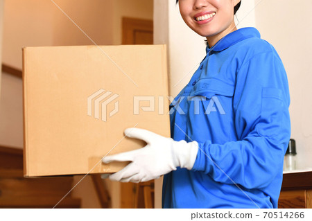 Courier female driver delivering luggage Courier female driver delivering luggage 70514266