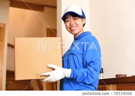 Courier female driver delivering luggage Courier female driver delivering luggage 70514268